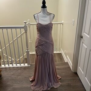 Simple elegance wrapped in desert rose with spaghetti straps, floor length